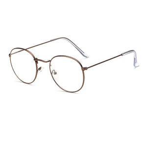 Glasses made out of thin alloy material in a bright brown finish. The material is smooth and the lens are transparent.