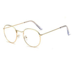 Glasses made out of thin alloy material in a bright gold finish. The material is smooth and the lens are transparent.