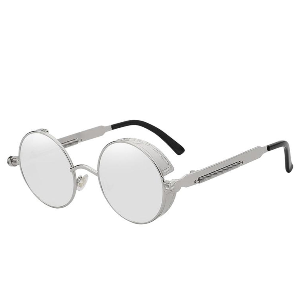 Stylish sunglasses with a silver lens and a silver rounded frame. The edges of the frames are extended by a small stylish bezel to cover the top and bottom of the eyes. With a spring attached across to the lower part of the handles.