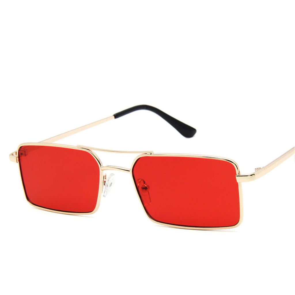 Sunglasses with a thin build and rectangle-shaped lens. The frame is gold and has a simple line connecting two parts at the top and in the middle of the lens. The colour of the lens is a shade of red.