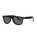 A simple and plain pair of sunglasses with a thick black frame and oval-shaped lens. The lens is a tint of black.