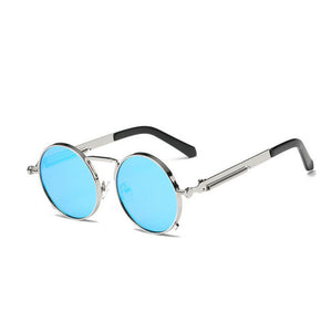 A round pair of sunglasses with a black ring-shaped frame around the lens. With a thin design around the handles and a thin line between the top lens. The lens is a light tint of blue.