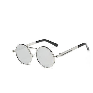 A round pair of sunglasses with a silver ring-shaped frame around the lens. With a thin design around the handles and a thin line between the top lens. The lens is a shade of silver.
